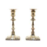 A pair of Queen Anne style candlesticks by Ellis & Co,