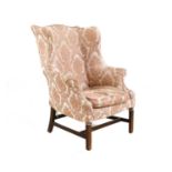 A George III wing armchair,