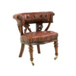 A mid-Victorian buttoned leather desk chair,