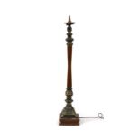 A turned wooden and brass mounted standard lamp,