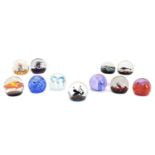 A collection of Caithness glass paperweights,