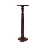 A large mahogany torchere