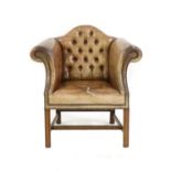 A camel backed Edwardian leather armchair,