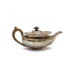 A silver teapot,