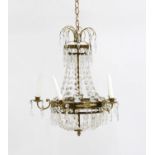 A Louis XVI style five light brass framed cut glass chandelier,