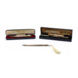 A cased silver propelling pencil,