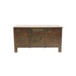 A 17th century oak panelled coffer,