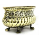 A repoussé brass wine cooler/jardinière,