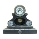 A large marble and slate mantel clock,