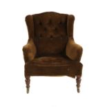 A Victorian Howard style armchair,
