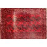 A large red ground bokhara carpet,