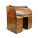 A Victorian burr walnut revolving cylinder top desk