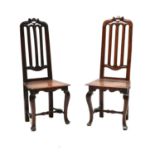 A matched pair of 17th century style walnut high back chairs,