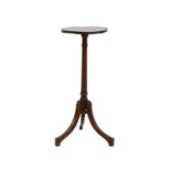 An Edwardian mahogany candle table,