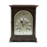 An oak mantel clock,