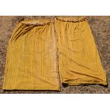 A pair of yellow ribbed velvet curtains,