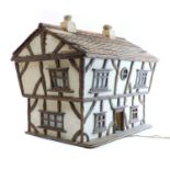 A 1950's cottage style dolls house,