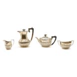 A composed four-piece silver tea service,