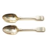 A pair of Victorian silver fiddle pattern table spoons