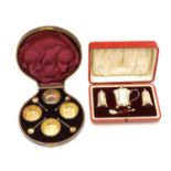 A cased set of four silver table salts,