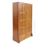 A Cotswold School cherrywood cabinet,