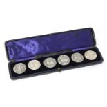 A cased set of six Art Nouveau silver buttons,