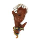 A Goldscheider pottery wall mask,