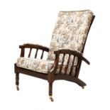 A pair of Morris-type mahogany reclining armchairs,