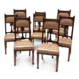 A set of eight Art Nouveau walnut dining chairs,