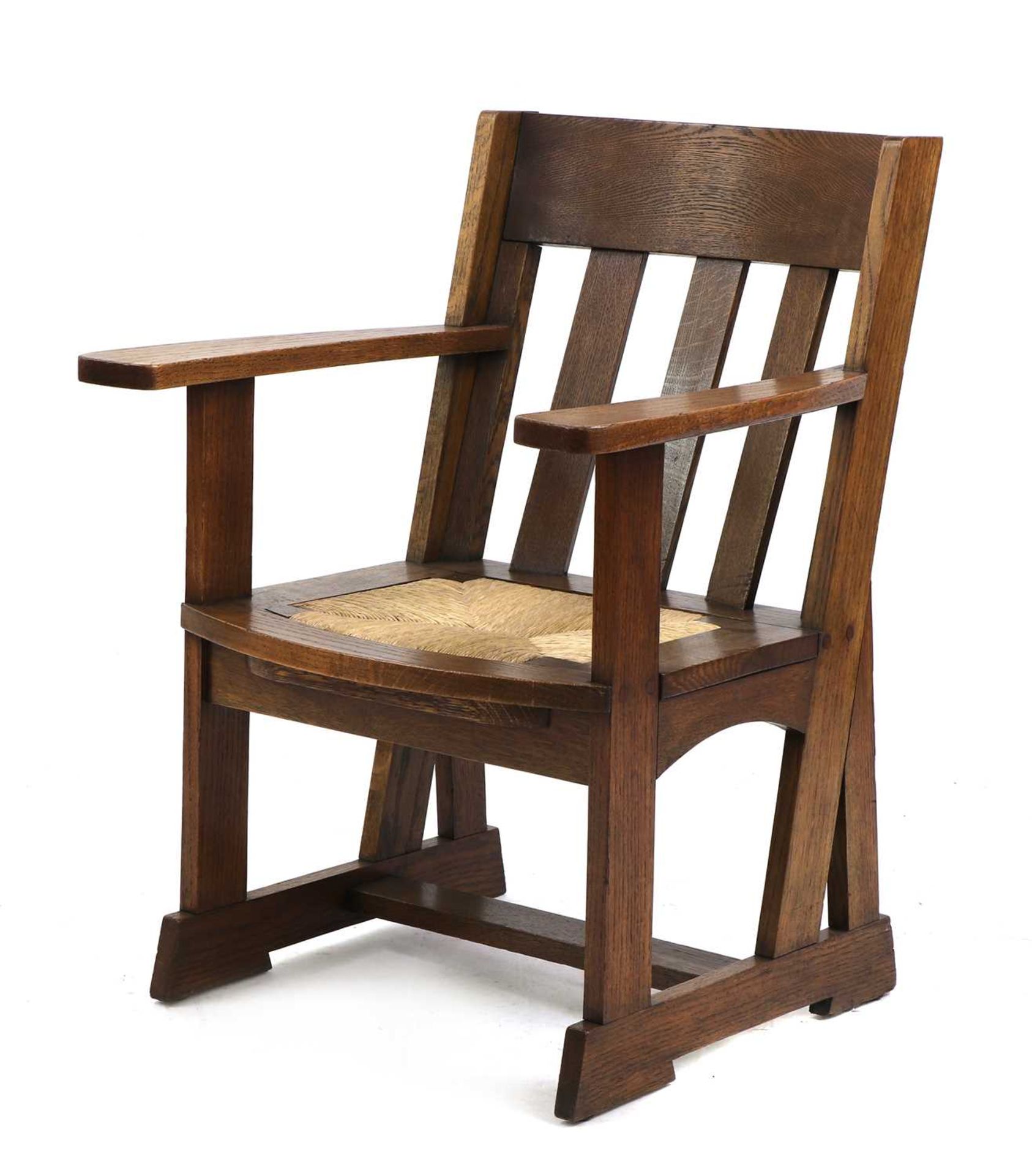 An Athelston oak armchair,