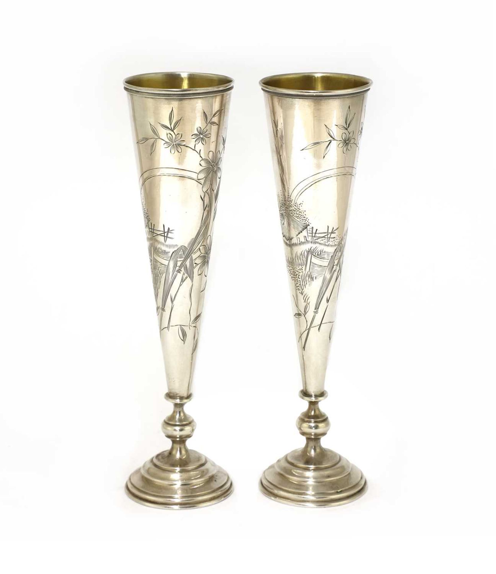 A pair of Russian silver spill vases,