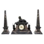 An Egyptian Revival marble and slate mantel clock garniture,