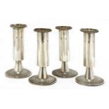 A set of four silver candlesticks,