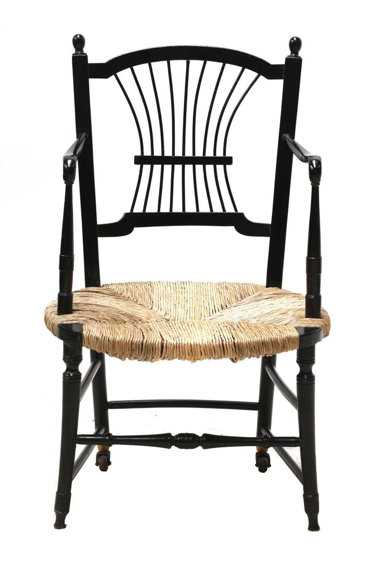 An ebonised 'Sussex' armchair, - Image 2 of 3