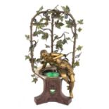 An unusual Art Nouveau cold-painted spelter table lamp,
