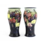 A pair of Moorcroft 'Wisteria' vases,