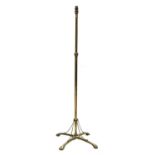 An Arts and Crafts brass standard lamp,