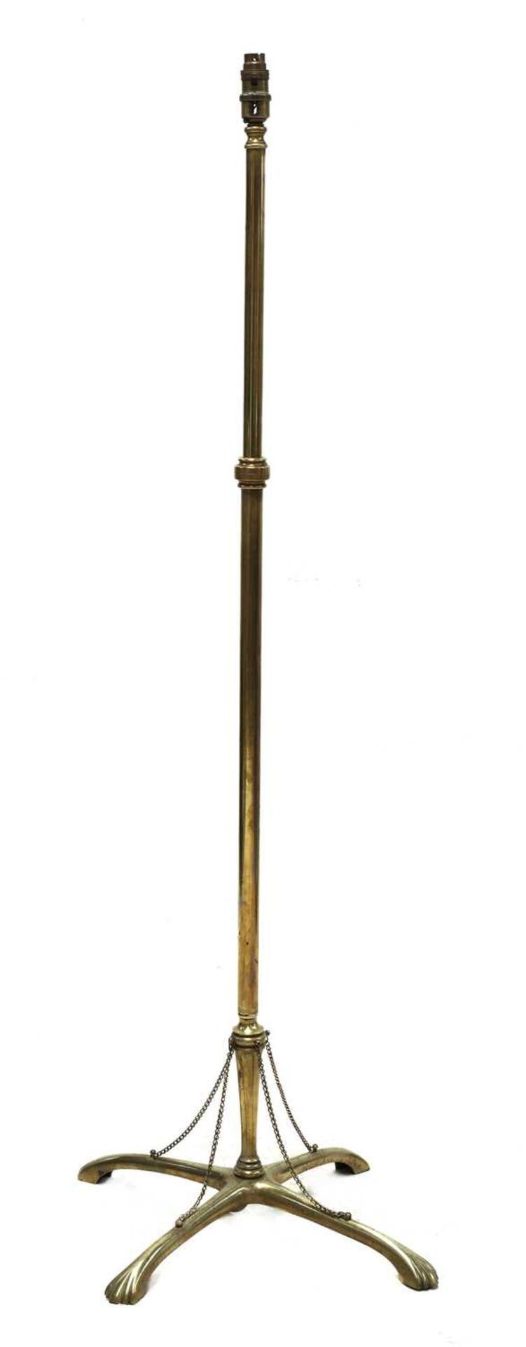 An Arts and Crafts brass standard lamp,