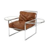 A chrome and tan leather armchair,