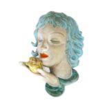 A Goldscheider pottery wall mask,