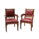 A pair of oak library armchairs,