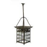 An Arts and Crafts brass hall lantern,