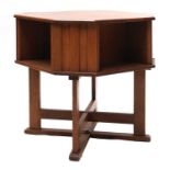 An Arts and Crafts oak octagonal book table,