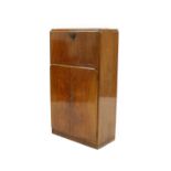 An Art Deco walnut cocktail cabinet,