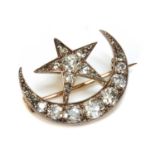 A late Victorian diamond set crescent and star brooch,