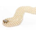 A three row uniform cultured pearl necklace,