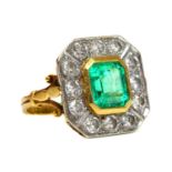 An 18ct gold emerald and diamond octagonal cluster ring,