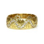 An 18ct gold diamond set band ring, c.1970,