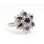 A white gold sapphire and diamond snowflake cluster ring,