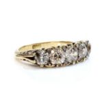 A five stone diamond carved head ring,